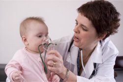 doctor consulting the health of a baby